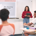 Girl gives presentation in front of class